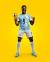Soccer Player Wearing Jersey and Shorts Holds Cup Mockup