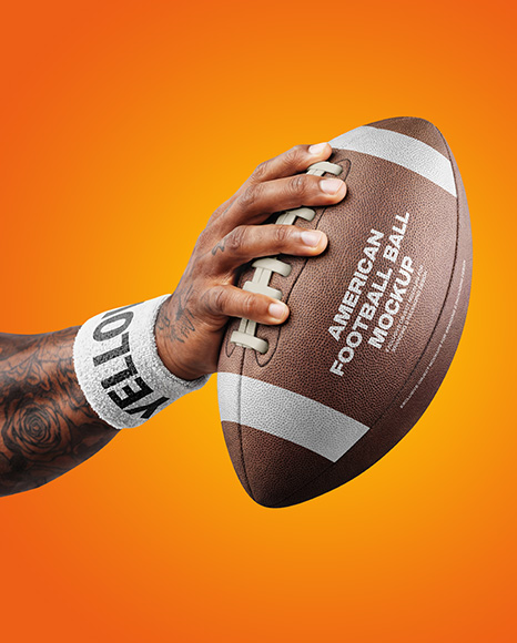 American Football Ball in a Hand Mockup