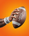 American Football Ball in a Hand Mockup