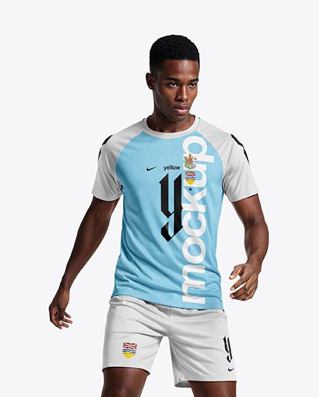 Soccer Player Wearing Raglan Jersey and Shorts Mockup