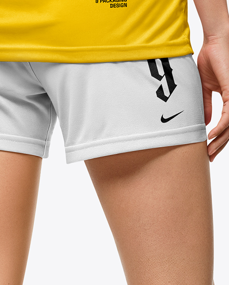 Female Soccer Player Wearing Jersey and Shorts Mockup