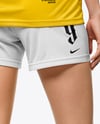 Female Soccer Player Wearing Jersey and Shorts Mockup