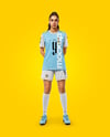 Woman Wearing Soccer Jersey and Shorts Mockup