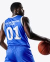 Basketball Player Wearing Jersey and Shorts with Basketball Mockup