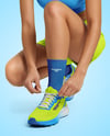 Running Shoes on Women's Legs Mockup