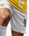 Man Wearing Soccer Jersey and Shorts Mockup