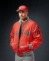 Baseball Player Wearing a Bomber Jacket and Cap Mockup