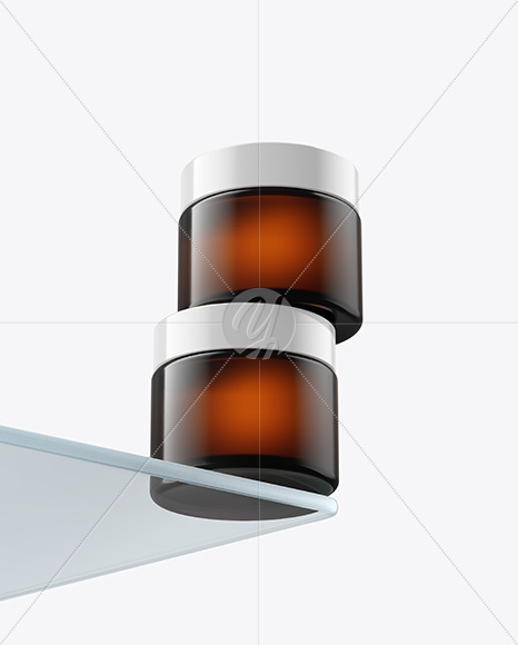 Two Amber Cosmetic Jars on the Glass Mockup
