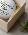 Glossy Christmas Ball in a Box Mockup