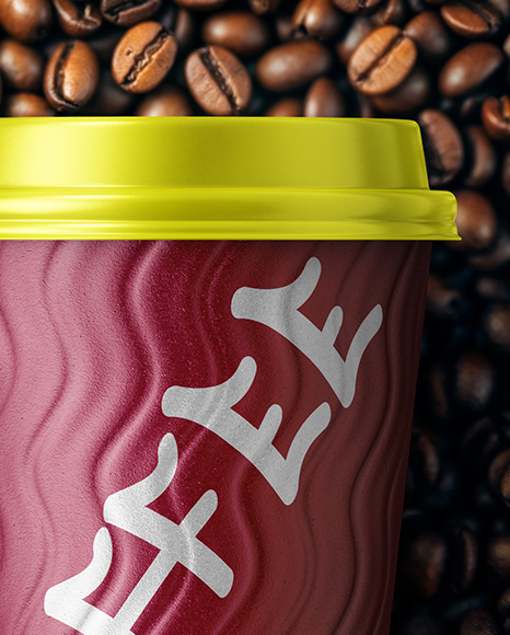 12oz Paper Cup on a Stack of Coffee Beans Mockup