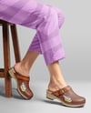 Pair of Clogs on Woman's Legs Sitting on Stool Mockup