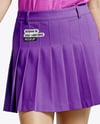 Woman Wearing Golf Shirt and Skirt Mockup