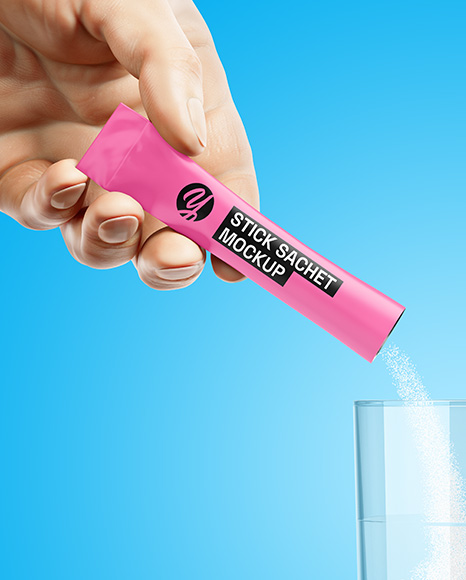 Matte Stick Sachet With Powder in a Hand & Water Glass Mockup