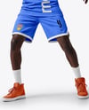 Basketball Player Wearing a Crew Neck Jersey and Shorts Holding a Basketball Mockup
