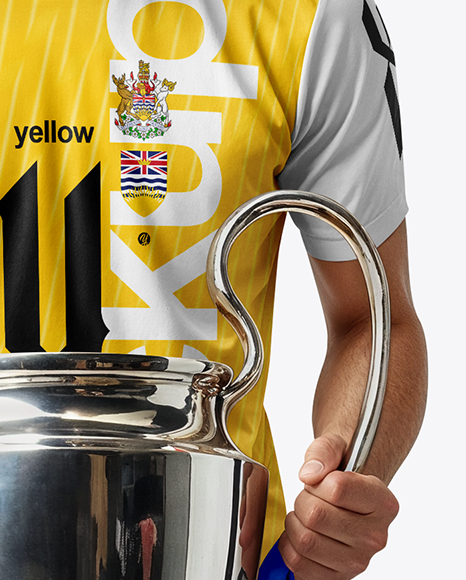 Man Wearing Soccer Jersey and Shorts Holds Cup Mockup