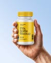 Plastic Pill Bottle in a Hand Mockup