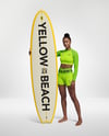 Woman Wearing Long Sleeve Rashguard and Shorts Holding Surfboard Mockup