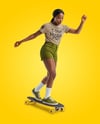 Black Woman Wearing T-Shirt and Shorts Standing on Longboard Mockup