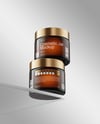 Two Amber Cosmetic Jars on the Glass Mockup