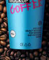16oz Paper Cup on a Stack of Coffee Beans Mockup