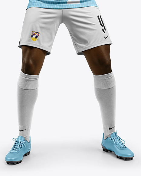 Soccer Player Wearing Jersey and Shorts Holds Cup Mockup
