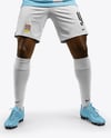 Soccer Player Wearing Jersey and Shorts Holds Cup Mockup