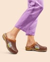 Pair of Clogs on Woman's Legs with Pants Mockup