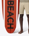 Man Wearing Rashguard Jersey and Shorts with Surfboard Mockup