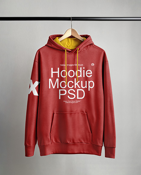 Hoodie on a Wooden Hanger Against a Plain Background Mockup