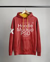 Hoodie on a Wooden Hanger Against a Plain Background Mockup