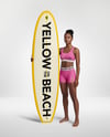 Woman Wearing Sports Bra and Shorts Holding Surfboard Mockup