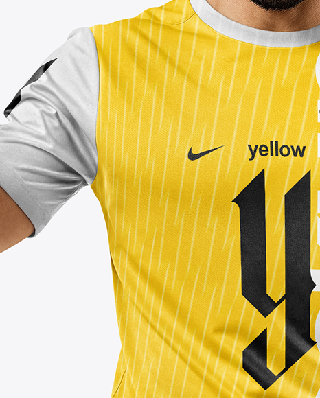 Man Wearing Soccer Jersey and Shorts Holds Cup Mockup