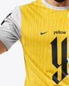 Man Wearing Soccer Jersey and Shorts Holds Cup Mockup