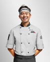 Asian Man Wearing Chef Uniform and Headband Mockup