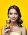 Woman Holding Matte Cosmetic Tube in a Hand Mockup