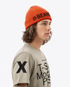 Young Man Wearing T-Shirt and Beanie Hat Holding Skateboard Mockup