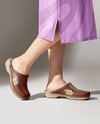 Pair of Clogs on Woman's Legs with Skirt Mockup