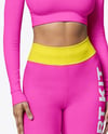 Woman Wearing a Long Sleeve Crop Top and Leggings Mockup