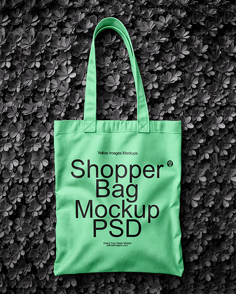 Tote Bag on a Green Leafy Background Mockup