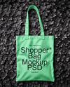 Tote Bag on a Green Leafy Background Mockup