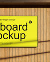 Billboard on a Wall with Wooden Slats Mockup