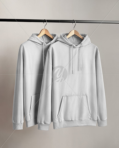 Two Hoodies on a Wooden Hanger Against a Plain Background Mockup