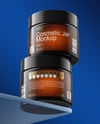 Two Amber Cosmetic Jars on the Glass Mockup