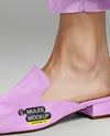 Pair of Suede Mules on Woman's Legs with Pants Mockup