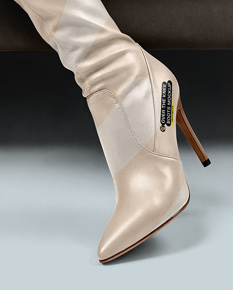 Pair of Over-The-Knee Boots on Women's Legs on Sofa Mockup
