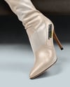 Pair of Over-The-Knee Boots on Women's Legs on Sofa Mockup