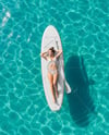 Woman Wearing Bikini Lying on SUP Board Mockup