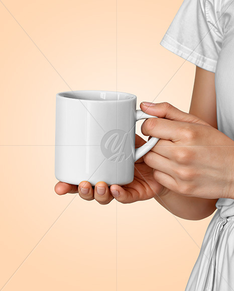 Woman Holding Glossy Mug in a Hands Mockup