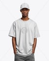 Black Man Wearing Oversized T-Shirt and Baseball Cap Mockup