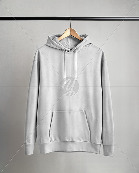 Hoodie on a Wooden Hanger Against a Plain Background Mockup